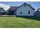 Spacious backyard with a deck, screened porch, and a well-maintained lawn, ideal for outdoor enjoyment at 623 White Ash Trl, Mooresville, IN 46158
