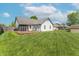 Spacious backyard featuring a wooden deck, lush lawn, and a shed, perfect for outdoor activities at 623 White Ash Trl, Mooresville, IN 46158