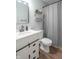 Bathroom features dark bronze fixtures, shelf decor, vanity with drawers, a toilet, and a shower at 623 White Ash Trl, Mooresville, IN 46158