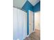 This bathroom features blue accent walls, a full shower-tub and a white door at 623 White Ash Trl, Mooresville, IN 46158