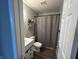 Well-maintained bathroom featuring a vanity, toilet, and shower with curtain at 623 White Ash Trl, Mooresville, IN 46158