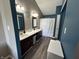 Bathroom with dual vanities, modern fixtures, and a full tub/shower combo at 623 White Ash Trl, Mooresville, IN 46158