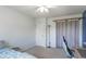 Bedroom with blue accent wall, carpeted floors, and a desk with a chair at 623 White Ash Trl, Mooresville, IN 46158