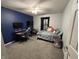 Comfortable bedroom features neutral carpet, ample natural light, and two desks at 623 White Ash Trl, Mooresville, IN 46158