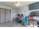 Bedroom featuring a desk, ceiling fan, treadmill, and a TV at 623 White Ash Trl, Mooresville, IN 46158