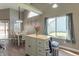 Bright kitchen featuring an island, a window that provides natural light, and an adjacent dining area at 623 White Ash Trl, Mooresville, IN 46158