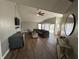 Inviting living room with hardwood floors, a ceiling fan, and ample seating space for relaxation at 623 White Ash Trl, Mooresville, IN 46158