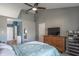 Comfortable main bedroom with a vaulted ceiling, large closet, and a view of the en-suite bathroom at 623 White Ash Trl, Mooresville, IN 46158