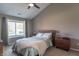 Spacious main bedroom features a vaulted ceiling, neutral walls, large window and comfortable Queen-size bed at 623 White Ash Trl, Mooresville, IN 46158