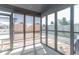 Cozy screened-in porch with a roller shade, providing a comfortable space to enjoy the outdoors at 623 White Ash Trl, Mooresville, IN 46158