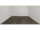 Spacious unfinished basement, perfect for storage or future expansion with dark wood-style flooring at 629 N Keystone Ave, Indianapolis, IN 46201