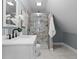 Stylish bathroom with a glass-enclosed shower, white vanity, and modern fixtures at 629 N Keystone Ave, Indianapolis, IN 46201