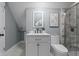 Elegant bathroom featuring modern fixtures, vanity, and shower with tasteful tile at 629 N Keystone Ave, Indianapolis, IN 46201