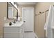 Bathroom featuring a sleek vanity, framed mirror, and modern fixtures at 629 N Keystone Ave, Indianapolis, IN 46201