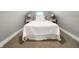 Small bedroom with carpet floor, full size bed, two side tables and lamps at 629 N Keystone Ave, Indianapolis, IN 46201