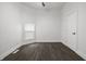 Empty bedroom featuring wood-look flooring, a ceiling fan, and natural light at 629 N Keystone Ave, Indianapolis, IN 46201