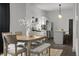 Bright dining area with a view into the well-equipped kitchen, perfect for Gathering meals at 629 N Keystone Ave, Indianapolis, IN 46201