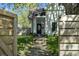 Street view of a charming home's exterior with landscaped walkway leading to the front door at 629 N Keystone Ave, Indianapolis, IN 46201
