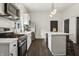 Stylish kitchen with stainless steel appliances, sleek countertops, and modern lighting fixtures at 629 N Keystone Ave, Indianapolis, IN 46201