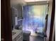 Bathroom featuring a vanity, toilet, and tub/shower combo with a ship-themed shower curtain at 630 Johnson Rd, Mooresville, IN 46158