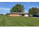 Charming brick home with an attached garage and a sprawling green lawn at 630 Johnson Rd, Mooresville, IN 46158