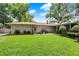 Spacious backyard with a stone patio and lush green lawn at 6440 Saint Joe Dr, Indianapolis, IN 46217