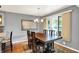 Formal dining room featuring a large wooden table, chandelier, and natural light at 6440 Saint Joe Dr, Indianapolis, IN 46217