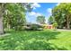 Lovely single-story home with lush green lawn and mature trees providing shade and curb appeal at 6440 Saint Joe Dr, Indianapolis, IN 46217
