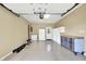 Garage features a workbench, a refrigerator, overhead storage, and a utility sink at 6440 Saint Joe Dr, Indianapolis, IN 46217