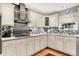 An eat-in kitchen featuring painted cabinets, granite countertops and stainless steel appliances at 6440 Saint Joe Dr, Indianapolis, IN 46217