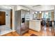 Kitchen with stainless steel refrigerator, eat-in island, hardwood floors and breakfast area at 6440 Saint Joe Dr, Indianapolis, IN 46217