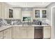 Modern kitchen with stainless steel appliances, bright lighting, and a stylish tile backsplash at 6440 Saint Joe Dr, Indianapolis, IN 46217