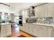 Bright kitchen showcases stainless steel appliances, white cabinets, and granite countertops at 6440 Saint Joe Dr, Indianapolis, IN 46217