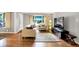 Inviting living room featuring hardwood floors, a comfortable seating area, and large windows at 6440 Saint Joe Dr, Indianapolis, IN 46217