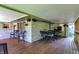 Covered patio with wood flooring, chairs and outdoor lighting at 6440 Saint Joe Dr, Indianapolis, IN 46217