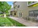 Landscaped backyard includes a concrete patio, lawn, and lush greenery at 65 Palomino Ct, Zionsville, IN 46077