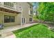 Expansive lawn and gardens compliment the home's backyard patio and upper-level balcony at 65 Palomino Ct, Zionsville, IN 46077