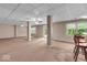 Spacious basement featuring tile ceiling and access to the outdoors at 65 Palomino Ct, Zionsville, IN 46077