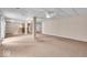 Finished basement featuring carpet, bar area, columns, and drop ceiling at 65 Palomino Ct, Zionsville, IN 46077