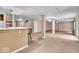 Finished basement with bar area, drop ceiling, and carpet at 65 Palomino Ct, Zionsville, IN 46077