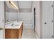 Bathroom featuring a double sink vanity, tile flooring and a shower tub with a white shower curtain at 65 Palomino Ct, Zionsville, IN 46077
