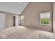 Large, carpeted bedroom with vaulted ceiling and several windows for plenty of natural light at 65 Palomino Ct, Zionsville, IN 46077