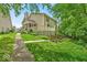 Charming two-story home features a porch, deck, and mature landscaping at 65 Palomino Ct, Zionsville, IN 46077