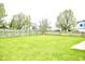 A large, well-maintained backyard with a wooden fence at 6634 Frankenberger Dr, Indianapolis, IN 46237
