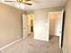 Bedroom with a ceiling fan and doors to a closet and en-suite bath at 6634 Frankenberger Dr, Indianapolis, IN 46237