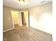 Bedroom with doors to closet and hallway, features neutral carpet at 6634 Frankenberger Dr, Indianapolis, IN 46237