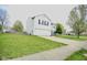 Well-maintained home with a spacious lawn, two-car garage, and inviting curb appeal at 6634 Frankenberger Dr, Indianapolis, IN 46237