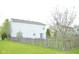 Exterior of house, showcasing the backyard with a wooden fence and trees at 6634 Frankenberger Dr, Indianapolis, IN 46237