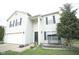 Classic home featuring black shutters, a front porch swing, and a well-manicured lawn at 6634 Frankenberger Dr, Indianapolis, IN 46237
