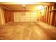 Spacious two car garage with concrete floors and exposed wooden frame at 6634 Frankenberger Dr, Indianapolis, IN 46237